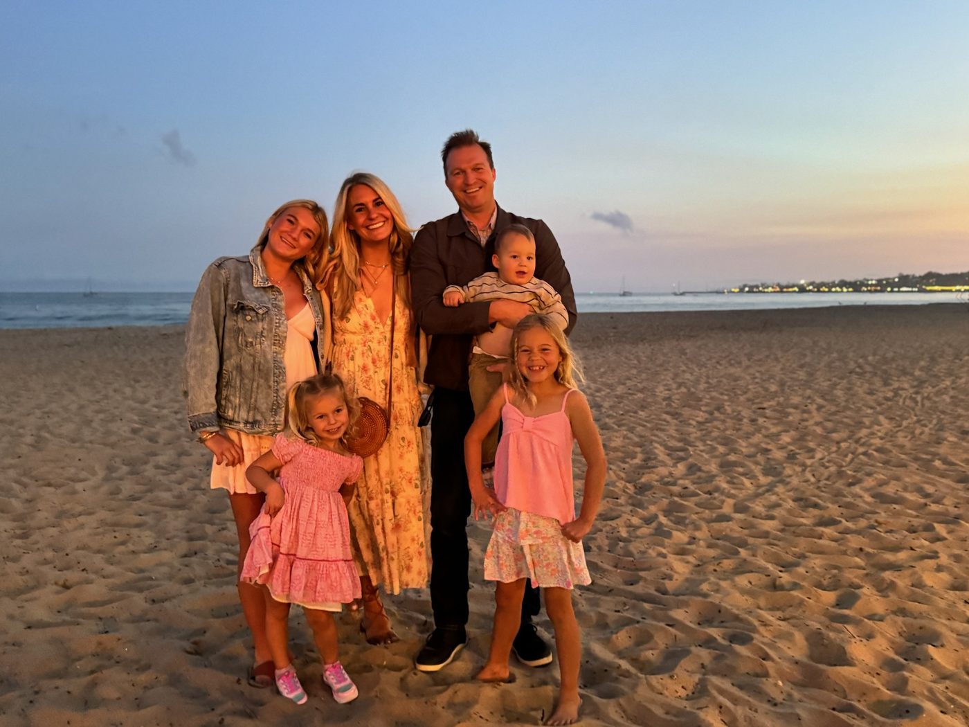 Caleb Overton with Ashley and their four children on a Santa Barbara beach at dusk