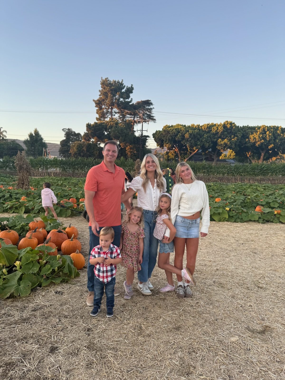 The Overton family at a pumpkin patch in the fall
